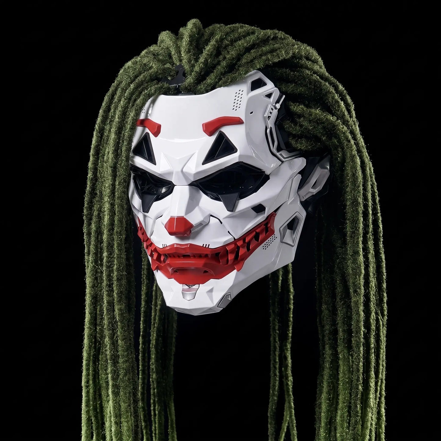 MaskVault Villain Mask, long green dreadlock style, white shell with red grin plate, on black